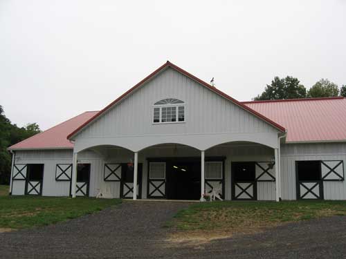 72'x200' Arena with 68'x84' Stall Barn and 36'x12' Portico Front View